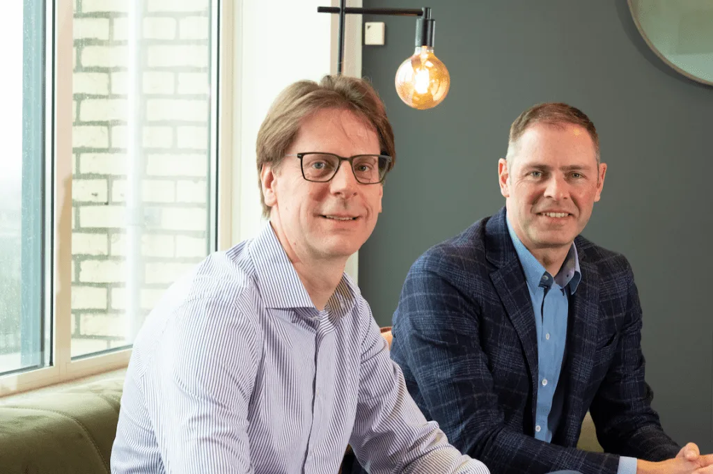 Zùsto founders seated in the Mechelen office